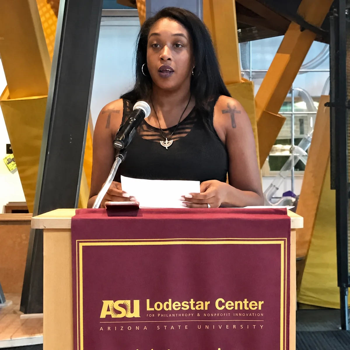 Nika Forte' speaking at a podium at the ASU Lodestar Center